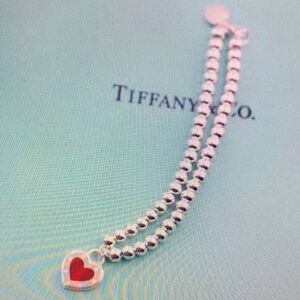 Tiffany & Co silver bead necklace with red heart charm and blue pouch